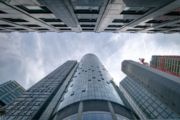 View up to the tops of skyscrapers with main tower in the middle, Frankfurt city, Germany