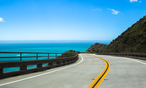 Curving Highway along Blue Sea on California Highway 1
