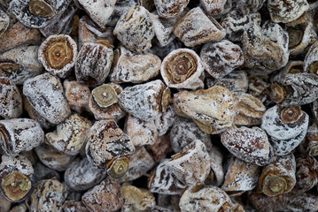 Dried persimmon texture background, close-up, top view. Preserved persimmon