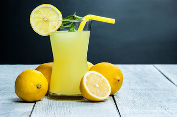 Lemonade in glass.Homemade Refreshment Summer cold drink with fresh lemons and mint. Lemon mojito...