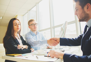 Successful business team with arms crossed at the office
