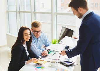 Successful business team with arms crossed at the office