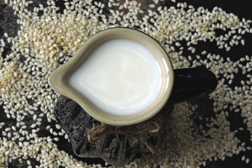 Sesame milk in a jug. Vegan drinks. Keto diet Keto drinks.