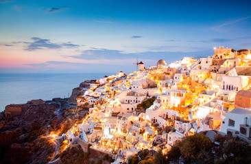 impressive evening view of Santorini island. Picturesque spring sunset on the famous Greek resort Oia, Greece, Europe. Traveling concept background.