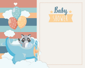 card of cute raccoon in the cradle and balloons