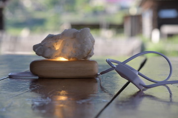 decorative night lamp and stones crystal. beautiful mystical composition with quartz crystal on a...