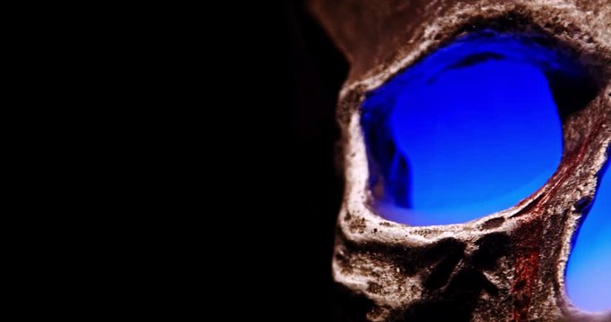 Smoke Skull with a Blue Glow camera panning over from frame right to left