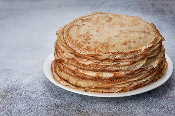 fresh pancakes on a plate white background