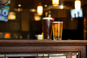 Two beers on wall at Irish pub