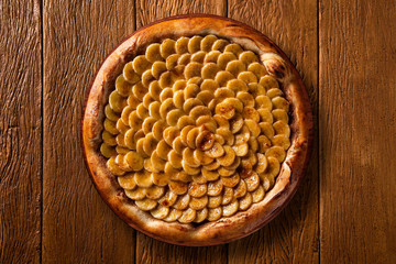 Pizza banana on wood background. Top view, close up. Traditional Brazilian Pizza