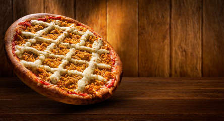 Pizza chicken and catupiry cheese on wood background. Top view, close up. Traditional Brazilian...