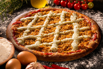 Pizza chicken and catupiry cheese on wood background. Top view, close up. Traditional Brazilian...