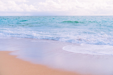 Tropical nature clean beach and white sand in summer with sun light blue sky and bokeh background.