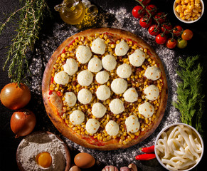 Pizza corn and cheese on Black concrete background. Top view, close up. Traditional Brazilian Pizza.