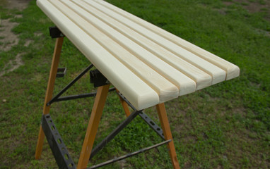 polished wooden bars on a natural background.