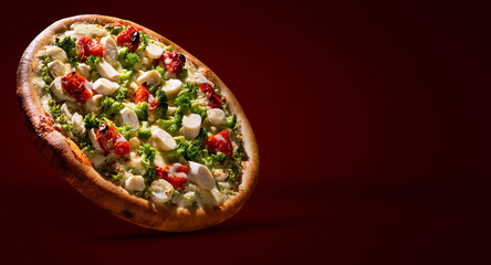 Pizza with broccoli, heart of palm and dried tomato. Top view, close up. Traditional Brazilian Pizza