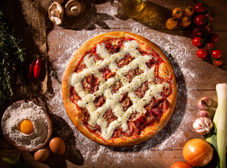 Pizza pepperoni with cream cheese on wood background. Top view, close up. Traditional Brazilian...