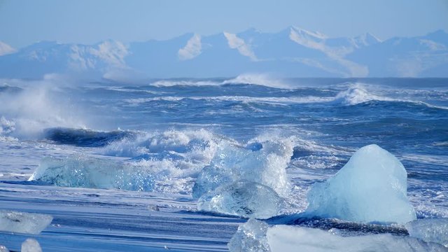 Ocean waves washed icebergs. Global warming problem