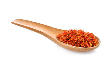 Safflower dried in wood spoon on white background