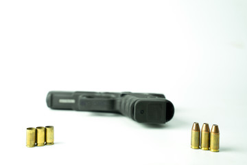 9 mm projectile and 9 mm gun on a white background