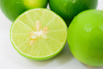 fresh limes on white background