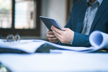 Close up of business man working at office.