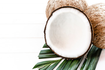 half coconut isolated on white wooden background