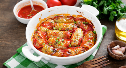 Traditional stuffed cabbage rolls with minced meat and rice, served in a tomato sauce.