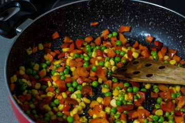 rustic colorful vegetarian stew cooking dish in frying pan