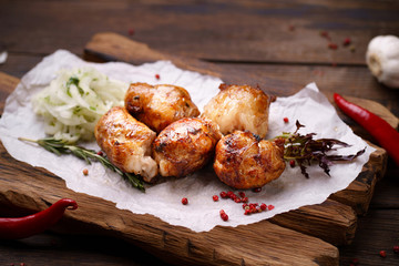 Grill bar, tasty chicken meat. Shish kebab with marinated onions garnishing on wooden board. Summer delicious food, weekend bbq party, picnic food
