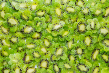 funny creative concept of sliced kiwi flower shape like background