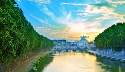 Fototapeta premium View of St. Peter's Basilica and Aelian Bridge in Rome at dusk.