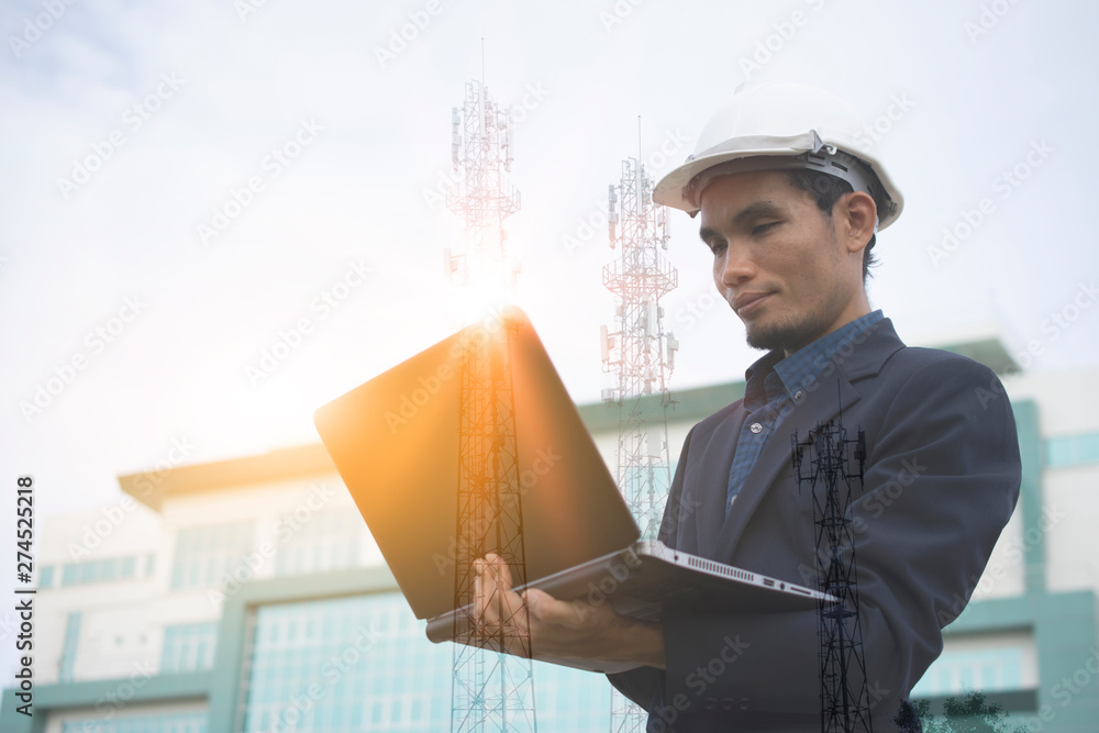 Poster engineer holding computer notebook for work and sky technology background