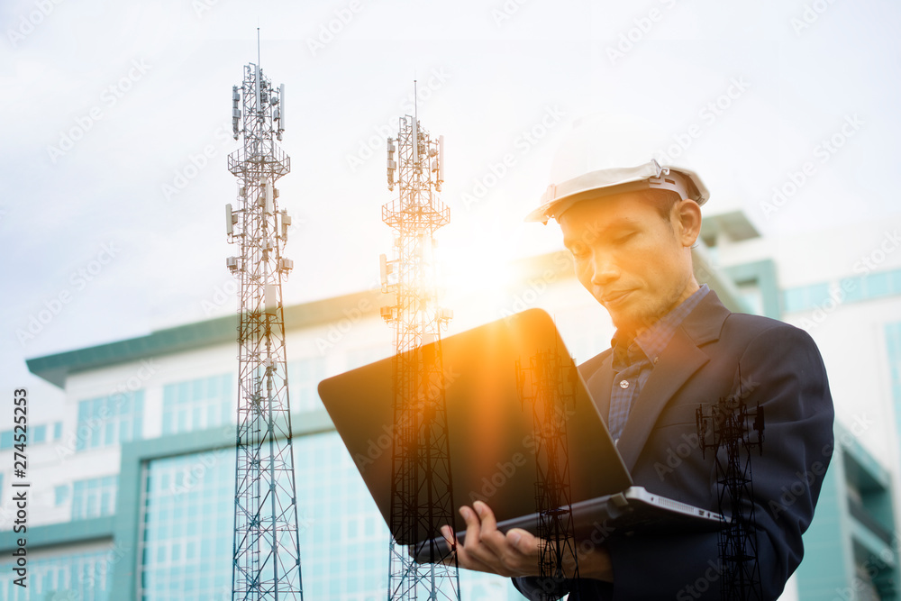 Poster engineer holding computer notebook for work and sky technology background