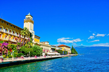  View of Gardone Riviera at the lakeside of Lake Garda in summer. - obrazy, fototapety, plakaty