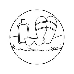 flip flops with sunglasses and bottle of blocker in beach