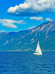 View of Lake Garda in northern Italy in summer. Lake Garda is a popular holiday location and the largest lake in Italy.