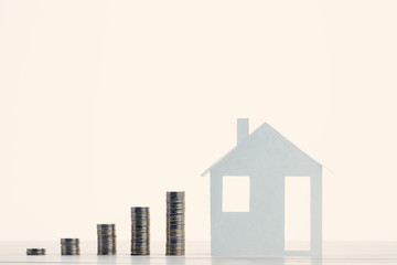 Money stack on wooden table. Concept for property ladder, mortgage and real estate investment. Investment and business growth concept.