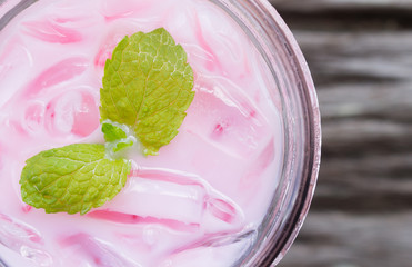 Pink Cold Milk Beverage or Cold Drinks and Peppermint Flatlay Left Frame