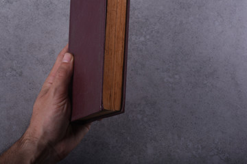 Old Book and Coffee on Stone Background