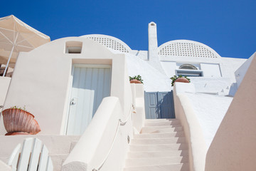beautiful Oia town on Santorini island, Greece. Traditional white architecture and greek orthodox...