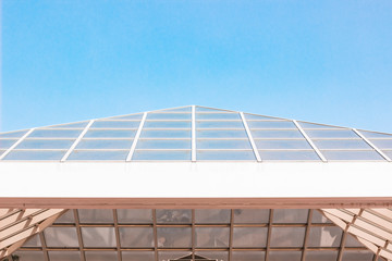 triangular glass dome of modern building architecture object simple background picture with empty copy space for text on blue sky 