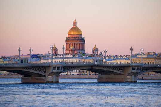 Dome of old St. Isaac Cathedral over  Annunciation Bridge in May twilight. St. Petersburg, Russia