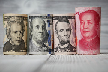 Chinese currency yuan and U.S. dollars amerkinaische bills