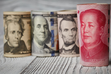 Chinese currency yuan and U.S. dollars amerkinaische bills