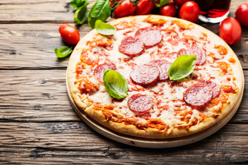 Italian pizza with tomato and salami