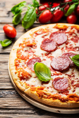 Italian pizza with tomato and salami