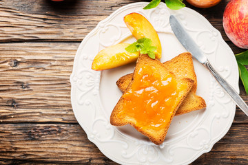 Healthy breakfast with toast and peach jam