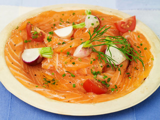 plate of salmon with dill radish tomatoes