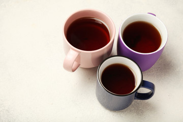 Black tea (coffee) in bright cups, office break, team building.